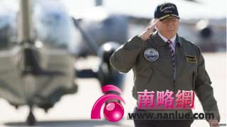 US President Donald Trump salutes as he walks to Air Force One